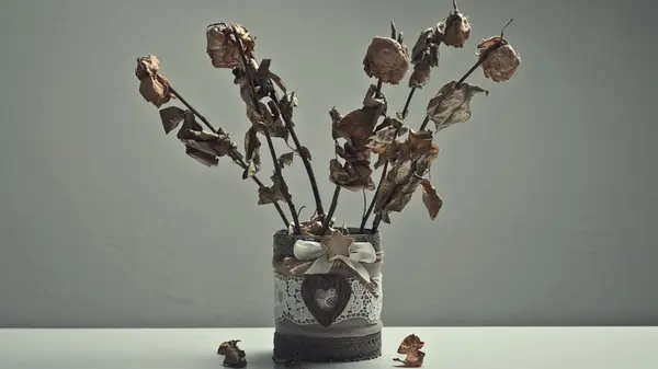 Dead roses in a vase