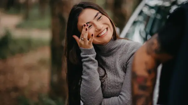 Woman touching forehead