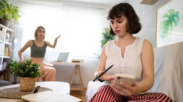 Distracted woman friend talking