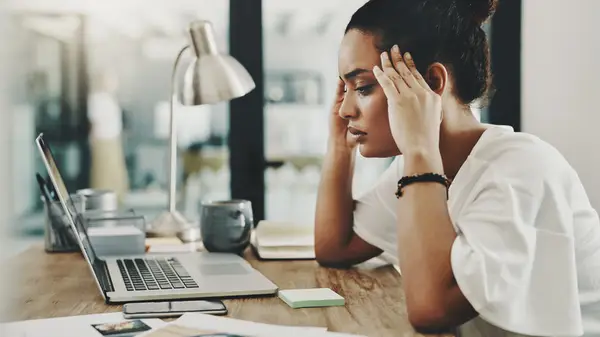 woman hands to temples