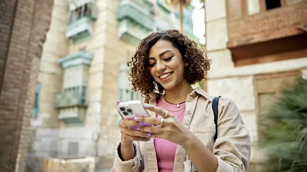 woman looking happy at phone
