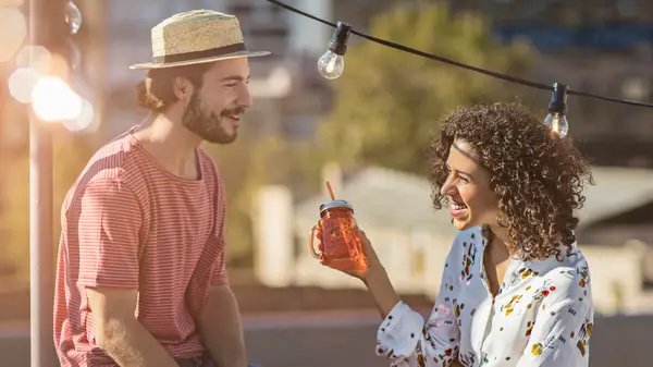 man and woman socializing 