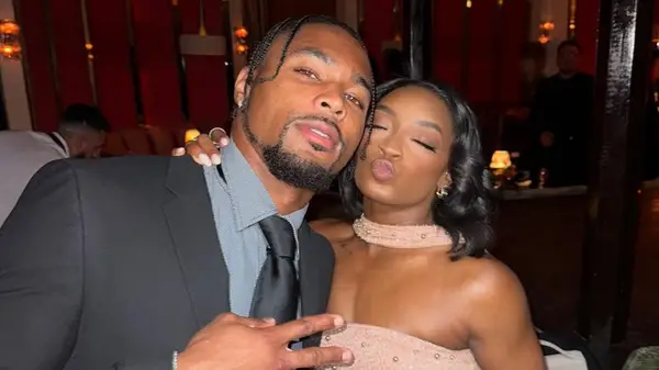 Simone Biles posing with Jonathan Owens