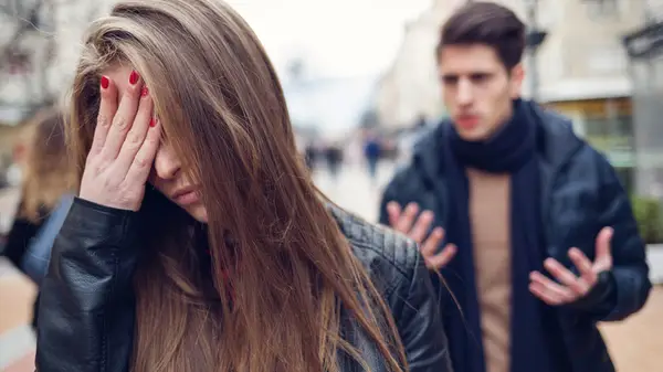 Couple arguing outside