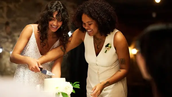 Lesbian wedding cake cut