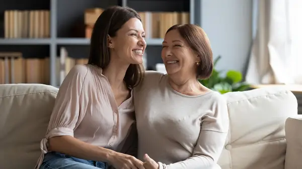 two women smiling together 