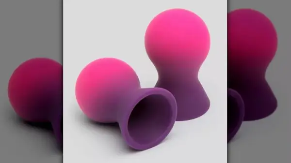 Two pink nipple suckers