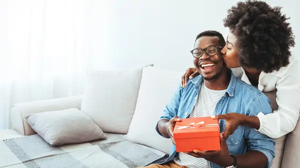 Couple exchanging gifts