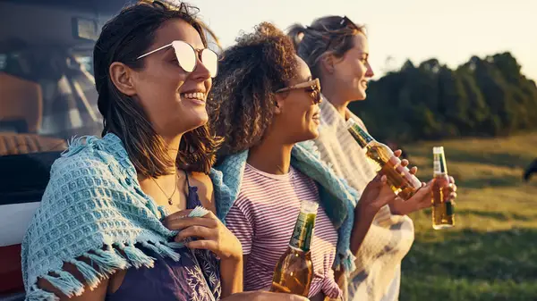 Friends drinking outside