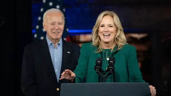 Joe Biden looking at Jill Biden on stage