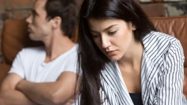 Couple after argument, looking sad