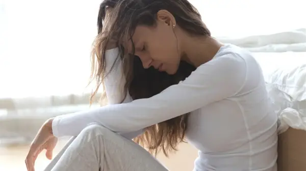 Woman sad with head down