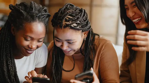 Women using dating apps together