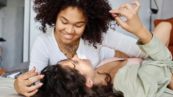 Couple smiling in bed