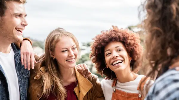 Group of people laughing and talking