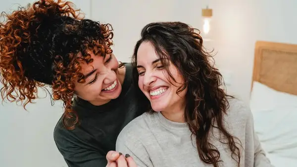 Two women smiling together