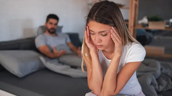 Couple fighting at bedtime