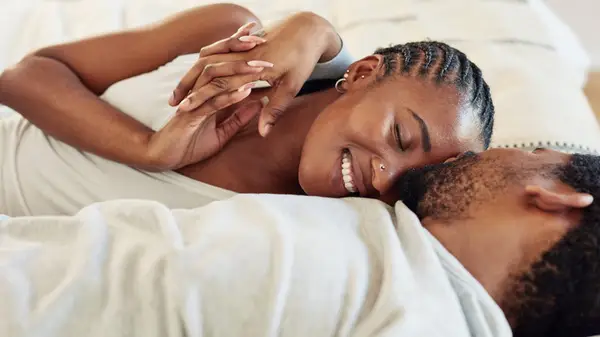 couple embracing in bed