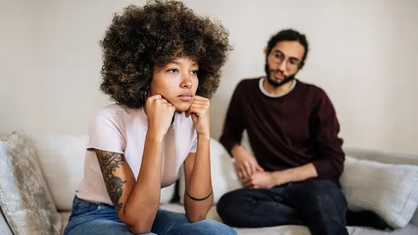 couple breaking up on couch