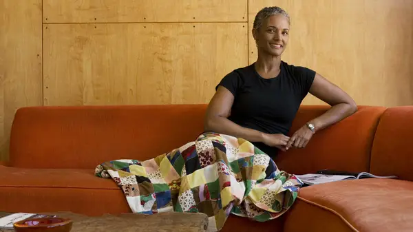 smiling woman on a couch