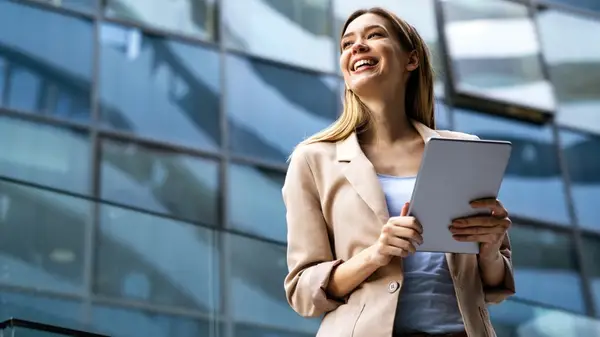 woman holding a tablet