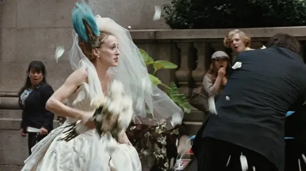 Carrie hitting Big with flowers in the SATC movie