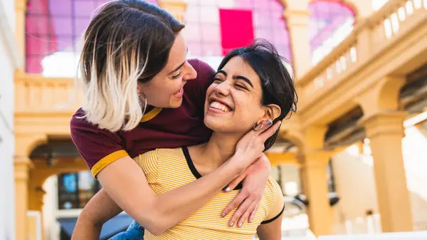 lesbian couple smiling