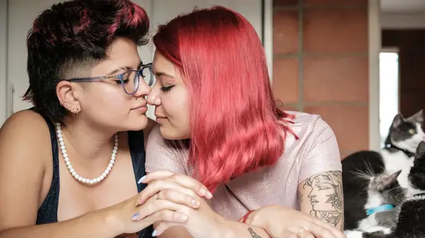 couple walks through park affectionately