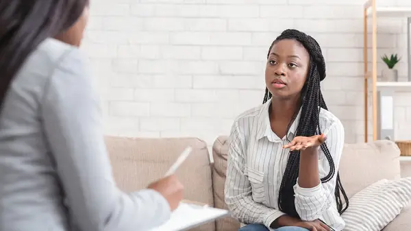 woman works with psychologist