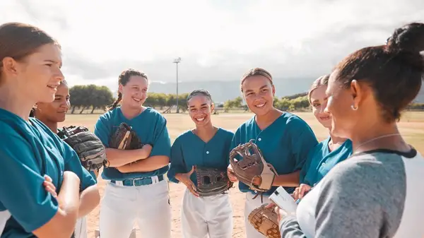 female softball team huddles
