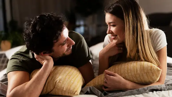 couple talking in bed