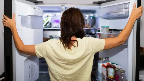 Looking in fridge