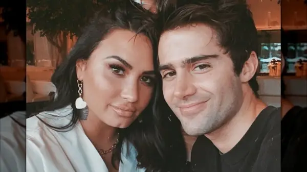 Demi Lovato smiling with Max Ehrich