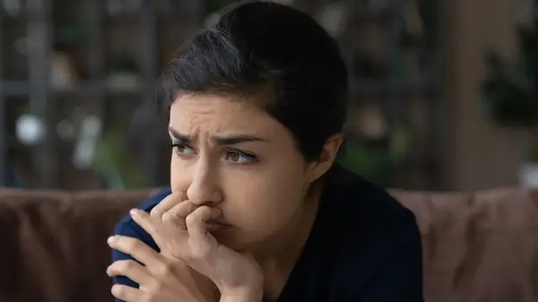 A woman looking worried 