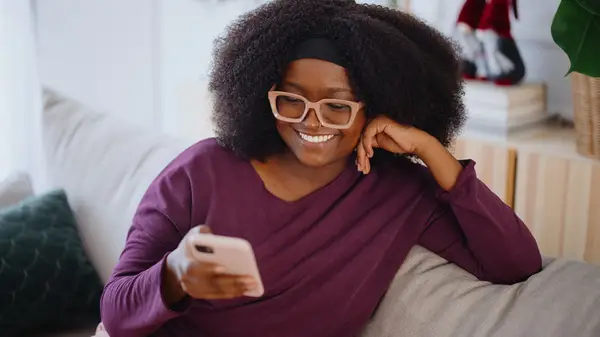 woman holding cell phone 