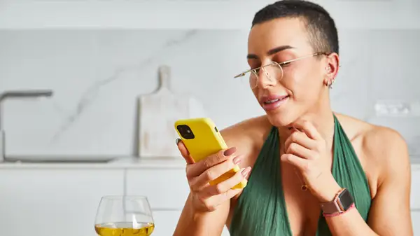 woman holding cell phone 