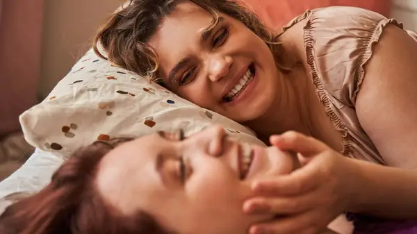 couple embracing in bed