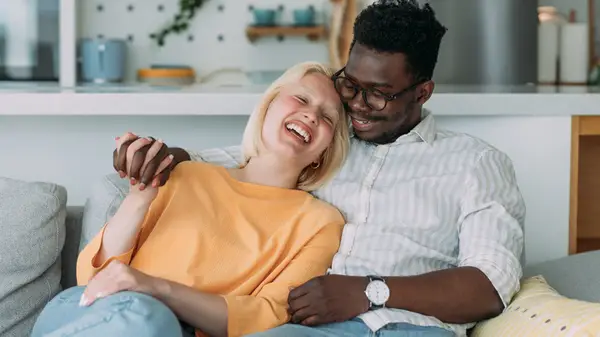 happy couple on couch