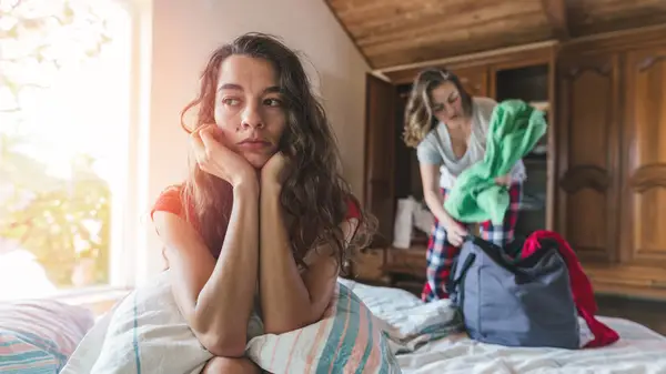 Person packing up and leaving their partner