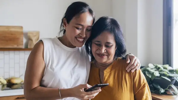 Two women looking at phone