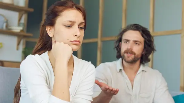 Man speaking to a woman