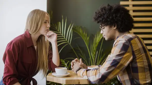 Couple talking over dinner