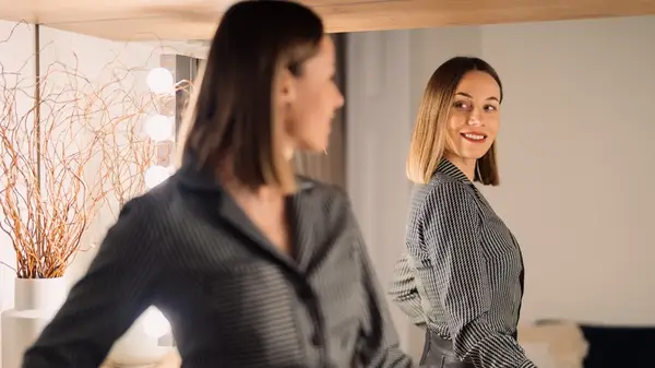 Woman looking at her reflection