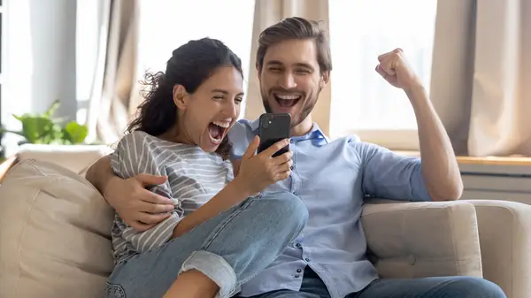Woman showing a man her phone