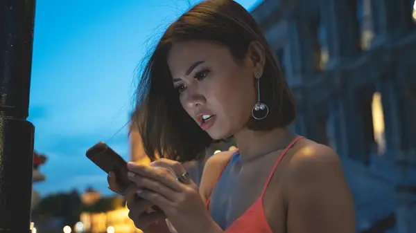 woman looking at phone