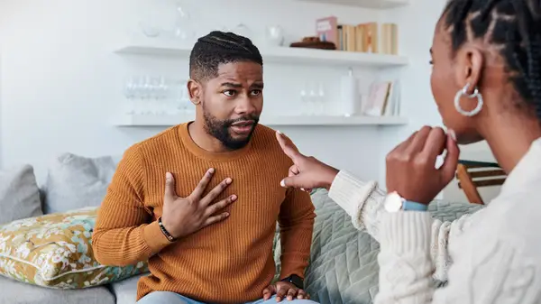 couple on couch arguing