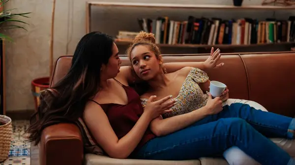 Couple talking on the couch