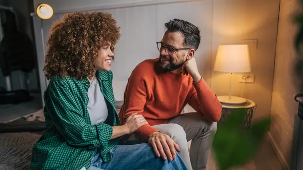 Couple smiling on couch