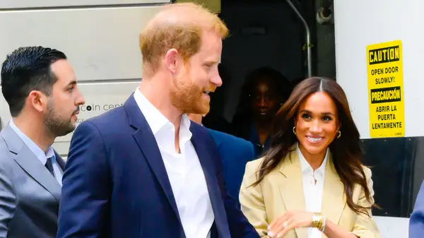 Meghan Markle and Prince Harry outside