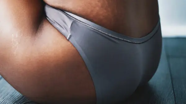 woman on floor in underwear